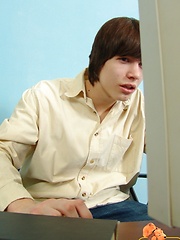 Boy Eric sits on chair and strokes dick