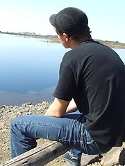 Handsome twink guy posing for the camera outdoors