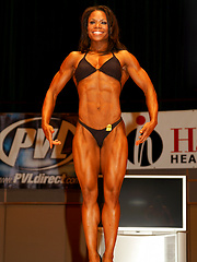 Musled black woman posing