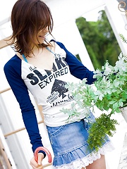 Cute Asian teen model in a mini skirt shows nice ass