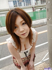 Japanese cutie starts taking off her clothes to show off