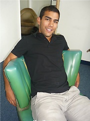 Hot latin dude Andres jerks his cock on black sofa