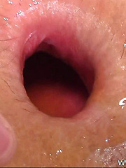Asian boy putting fresh vegetable into own anal hole